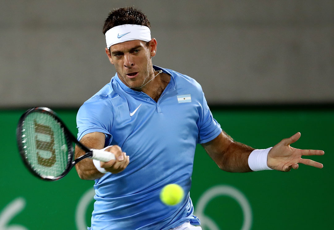 RIO DE JANEIRO, BRAZIL - AUGUST 07: Juan Martin Del Potro plays a forehand against Novak Dokovic of Serbia in their singles match on Day 2 of the Rio 2016 Olympic Games at the Olympic Tennis Centre on August 7, 2016 in Rio de Janeiro, Brazil. (Photo by Clive Brunskill/Getty Images)