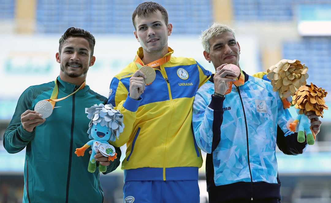 RIO DE JANEIRO, BRAZIL - SEPTEMBER 12: Silver medalist Fabio da Silva Bordignon of Brazil, gold medalist Ihor Tsvietov of Ukrain and and bronze medalist Hernan Barreto of Argentina celebrate on the podium at the medal ceremony for the Men's Long Jump T36 heat two at Olympic Stadium during day 5 of the Rio 2016 Paralympic Games on day 5 of the Rio 2016 Paralympic Games at on September 12, 2016 in Rio de Janeiro, Brazil. (Photo by Friedemann Vogel/Getty Images)