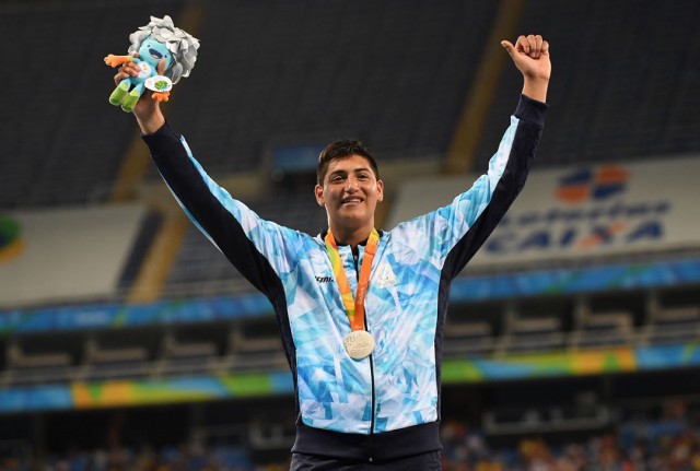 RIO DE JANEIRO, BRAZIL - SEPTEMBER 12: Silver medalist Hernan Emanuel Urra of Argentina celebrates on the podium at the medal ceremony for the Mne's Shot Put - F35 on day 5 of the Rio 2016 Paralympic Games at the Olympic Stadium on September 12, 2016 in Rio de Janeiro, Brazil. (Photo by Atsushi Tomura/Getty Images for Tokyo 2020)