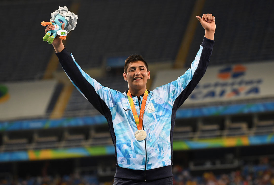 RIO DE JANEIRO, BRAZIL - SEPTEMBER 12: Silver medalist Hernan Emanuel Urra of Argentina celebrates on the podium at the medal ceremony for the Mne's Shot Put - F35 on day 5 of the Rio 2016 Paralympic Games at the Olympic Stadium on September 12, 2016 in Rio de Janeiro, Brazil. (Photo by Atsushi Tomura/Getty Images for Tokyo 2020)