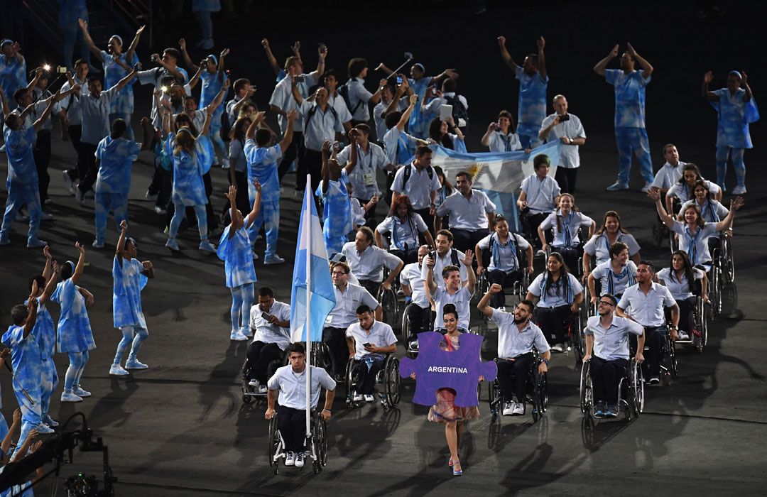 RIO DE JANEIRO, BRAZIL - SEPTEMBER 07: Flag bearer Gustavo Fernandez of Argentina leads the team entering the stadium during the Opening Ceremony of the Rio 2016 Paralympic Games at Maracana Stadium on September 7, 2016 in Rio de Janeiro, Brazil. (Photo by Atsushi Tomura/Getty Images)