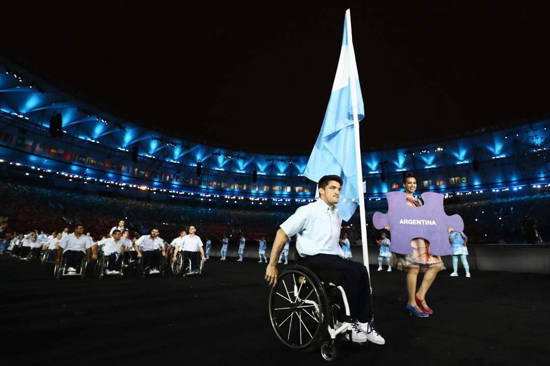 RIO DE JANEIRO, BRAZIL - SEPTEMBER 07: Flag bearer Gustavo Fernandez of Argentina leads the team entering the stadium during the Opening Ceremony of the Rio 2016 Paralympic Games at Maracana Stadium on September 7, 2016 in Rio de Janeiro, Brazil. (Photo by Buda Mendes/Getty Images)
