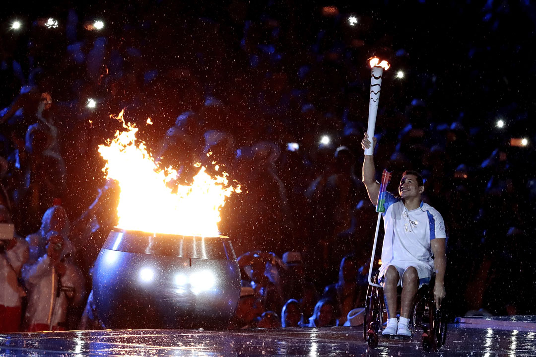 RIO DE JANEIRO, BRAZIL - SEPTEMBER 07: Swimmer Clodoaldo Silva of Brazil lights the Paralympic flame during the Opening Ceremony of the Rio 2016 Paralympic Games at Maracana Stadium on September 7, 2016 in Rio de Janeiro, Brazil. (Photo by Alexandre Loureiro/Getty Images)