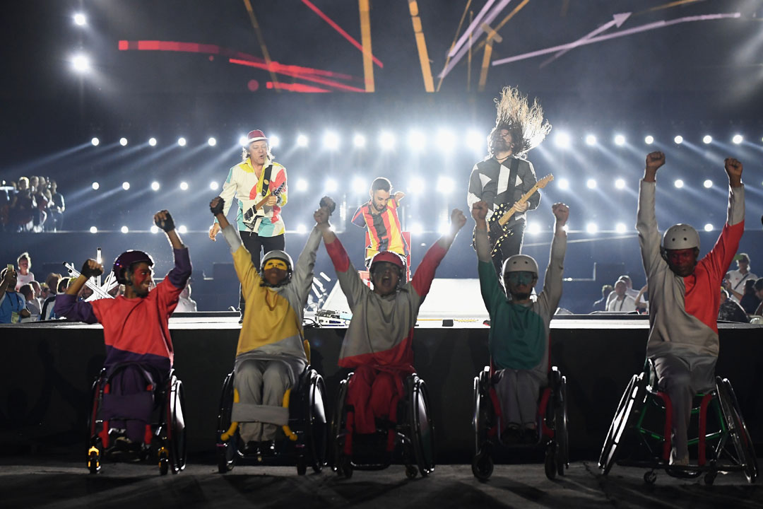 RIO DE JANEIRO, BRAZIL - SEPTEMBER 18: Wheelchair acrobats perform in front of a trio of guitar players (L - R) Armandinho, Johnatha and Andreas during the closing ceremony of the Rio 2016 Paralympic Games at Maracana Stadium on September 18, 2016 in Rio de Janeiro, Brazil. (Photo by Atsushi Tomura/Getty Images for Tokyo 2020)